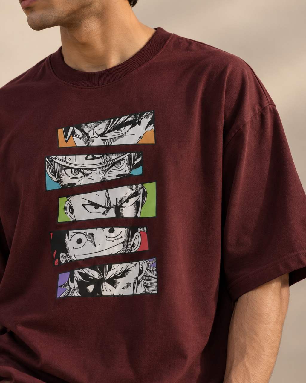 Burgundy/Maroon oversized T-shirt featuring five stacked black-and-white manga-style eye illustrations with colourful accent panels.