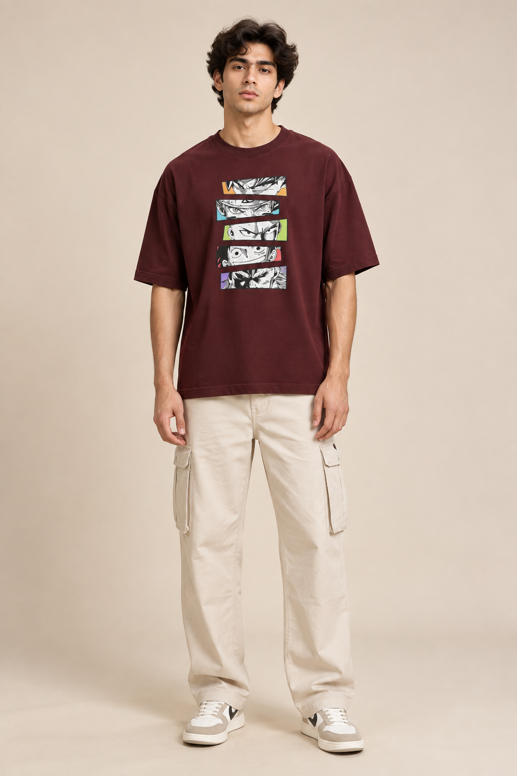 Burgundy/Maroon oversized T-shirt featuring five stacked black-and-white manga-style eye illustrations with colourful accent panels styled with baggy pants.