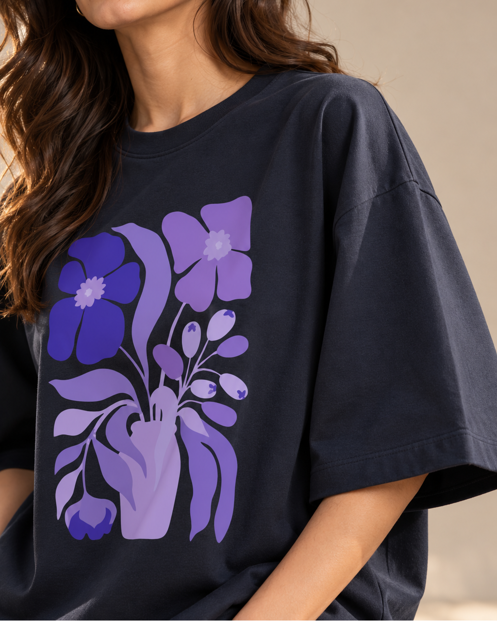 Purple and lavender botanical flower illustration on a navy blue graphic T-shirt