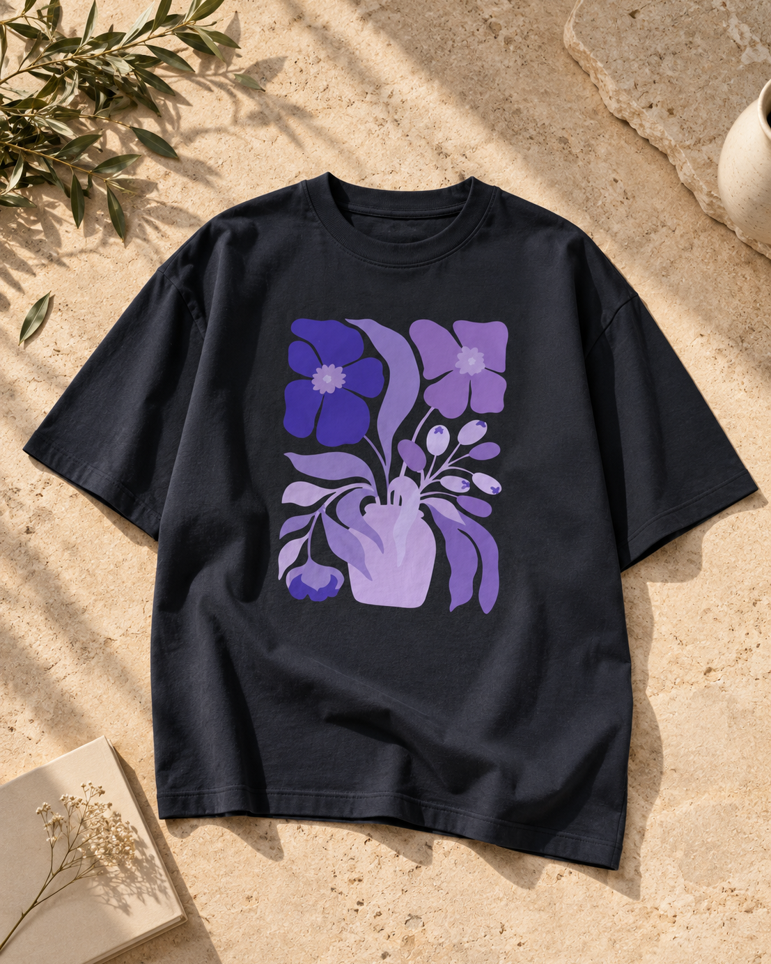 Purple and lavender botanical flower illustration on a navy blue graphic T-shirt