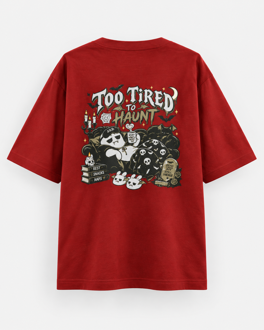 Back of a red oversized Halloween T-shirt featuring “Too Tired to Haunt” lettering, sleepy ghost artwork, bats, skulls, candles and gothic details.
