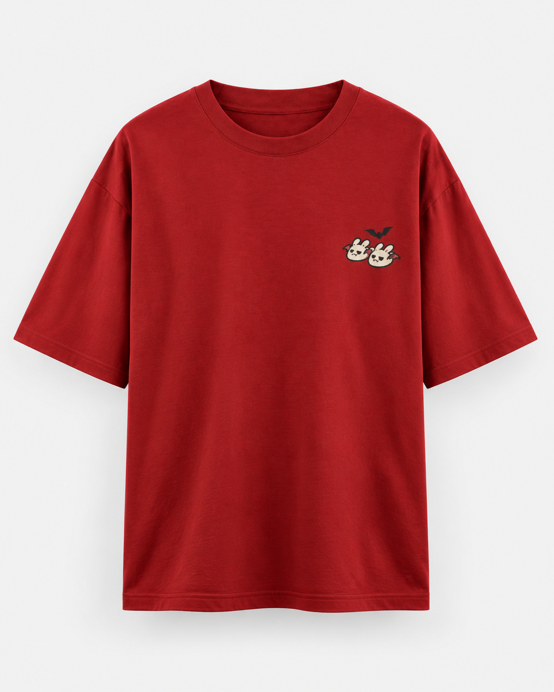 Red oversized Halloween T-shirt with a small cute ghost and bunny graphic and a black bat on the chest.
