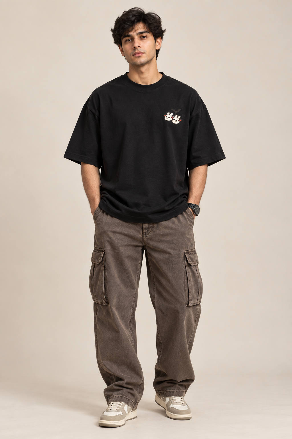 Black oversized T-shirt with a small cute ghost and bunny graphic paired with baggy pants