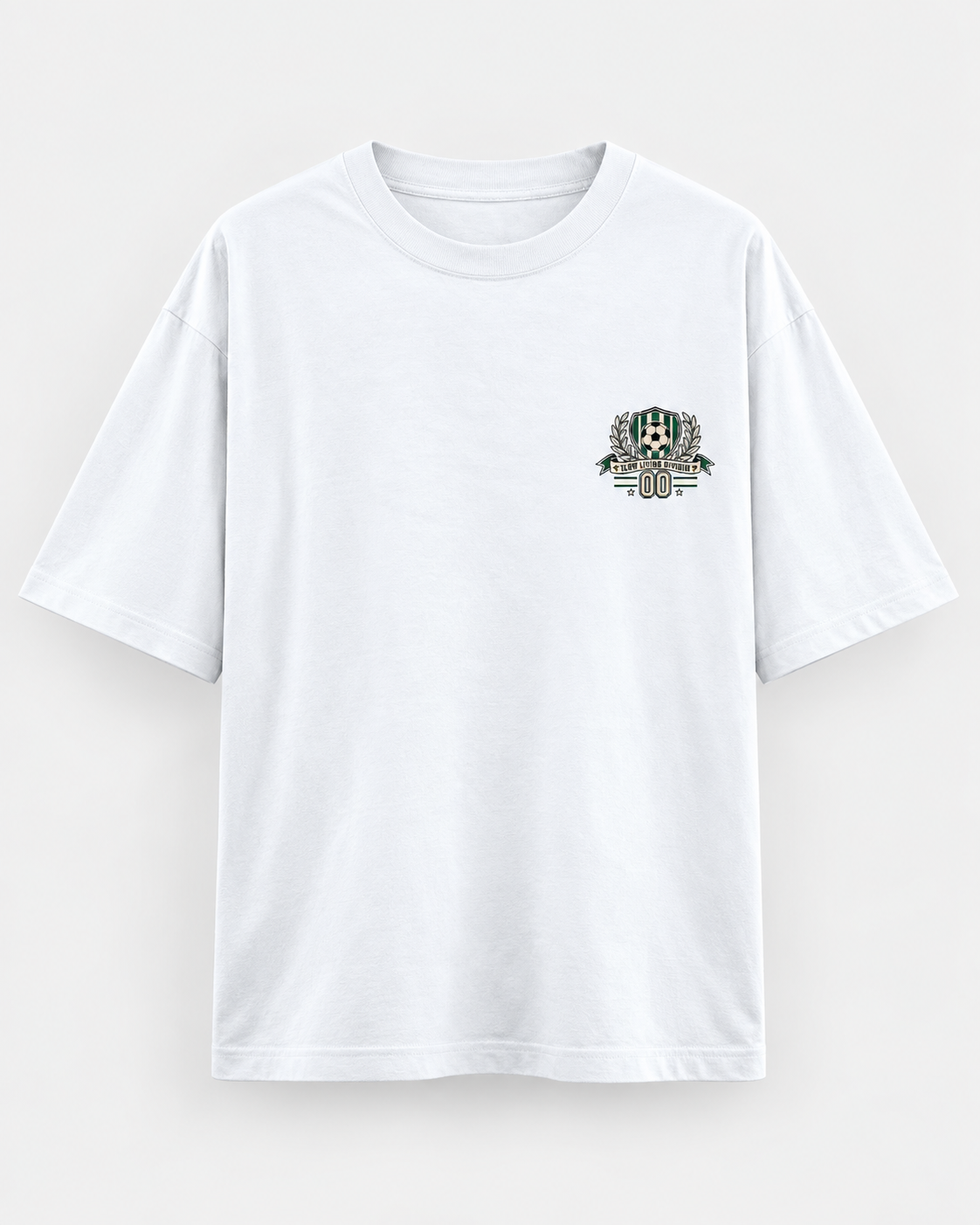 White oversized football T-shirt with a small green and cream soccer crest graphic on the chest.