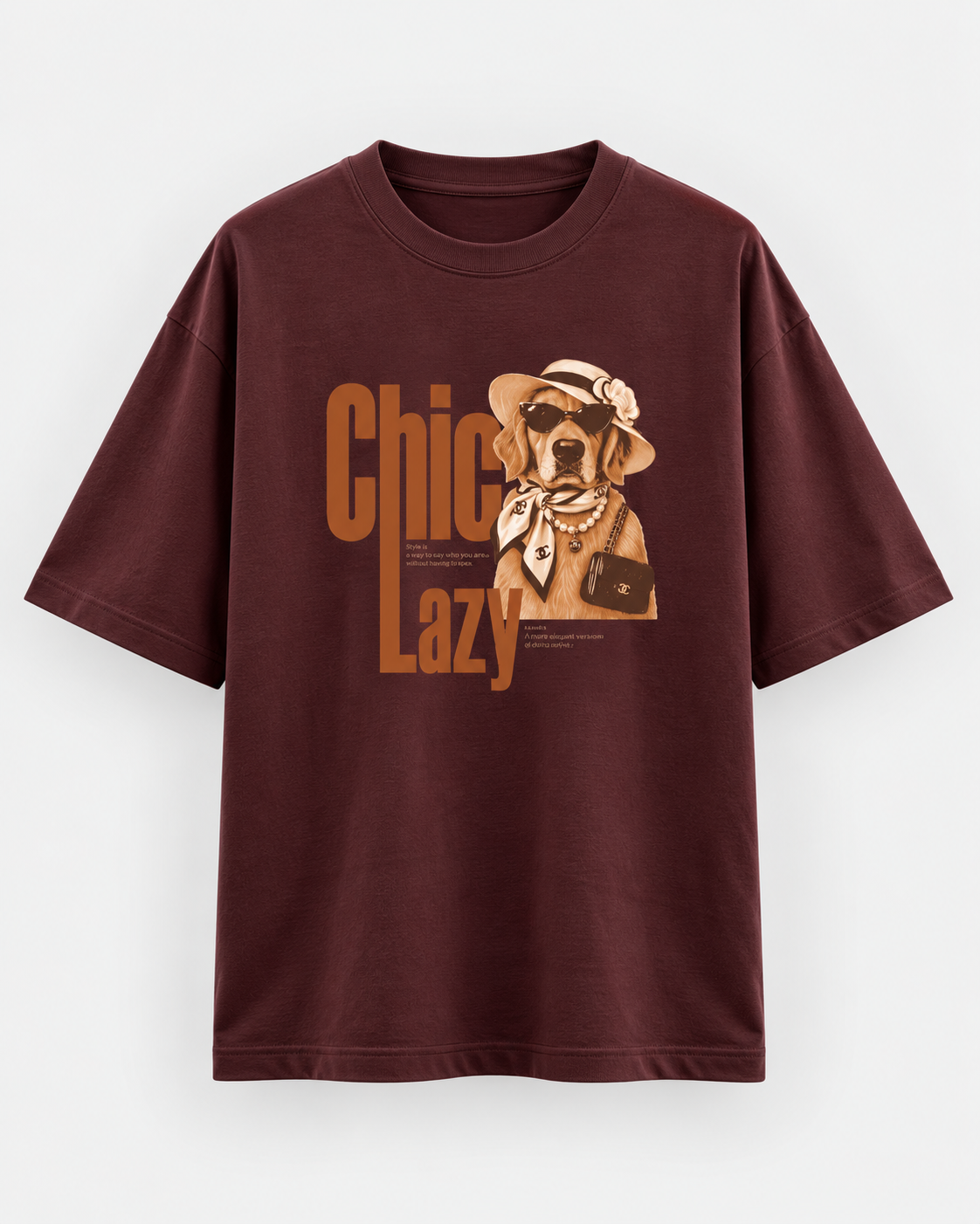 Burgundy oversized graphic T-shirt featuring a chic Golden Retriever illustration with sunglasses, hat, pearls and retro “Chic Lazy” typography.