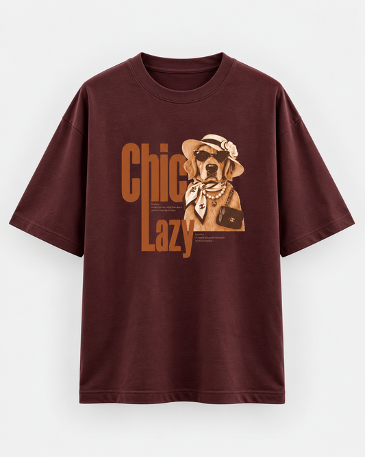 Burgundy oversized graphic T-shirt featuring a chic Golden Retriever illustration with sunglasses, hat, pearls and retro “Chic Lazy” typography.