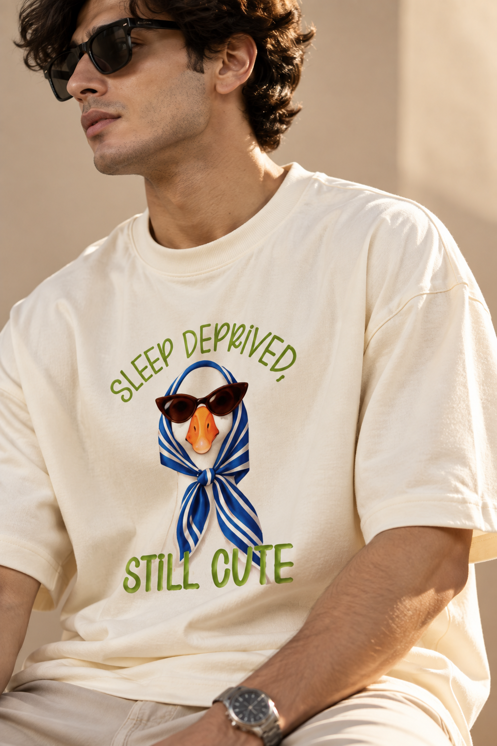 Funny duck illustration wearing sunglasses and a blue striped headscarf on a T-shirt